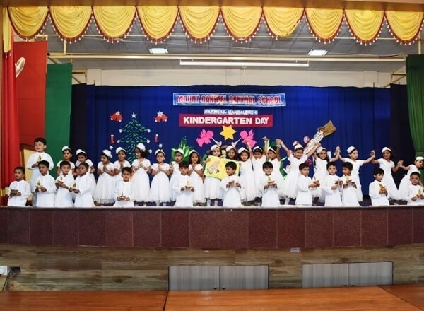 Colourful Kids on the Stage at MCCS Kindergarten Day 2016